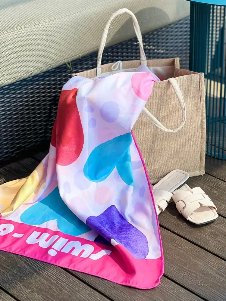 Colourful Swimdry Sweethearts towel at the beach